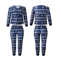 Božićna porodica koja odgovara pidžamim ispisanim prugastim vrhovima dugih rukava i rastezanje casual pantalona za spavanje